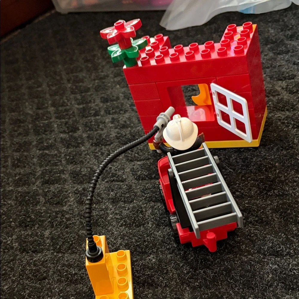 Lego Duplo Fire Truck With Firefighter Figure with fire hydrant and flame pieces